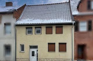 Haus kaufen in 39397 Gröningen, „Kompakt wohnen, großzügig parken – Reihenmittelhaus in Gröningen“