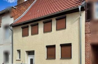 Haus kaufen in 39397 Gröningen, „Kompakt wohnen, großzügig parken – Reihenmittelhaus in Gröningen“