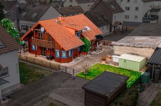 Einfamilienhaus kaufen in 64390 Erzhausen, EIN ZUHAUSE MIT SEELE - Freistehendes Einfamilienhaus in warmem Holzambiente in Erzhausen