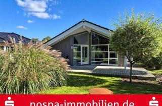 Haus kaufen in 24980 Schafflund, Bungalow im dänischen Stil mit offenem Wohnbereich und Carport mit Abstellraum.