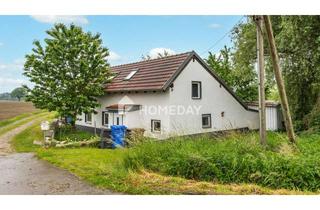 Einfamilienhaus kaufen in 94099 Ruhstorf, Zeitlos wohnen im Grünen – Einfamilienhaus mit überdachter Terrasse und Nebengebäude