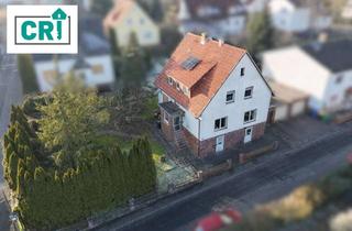 Haus kaufen in 35274 Kirchhain, Haus mit Charme und Entwicklungsmöglichkeiten – Garten, Keller und Garagen inklusive