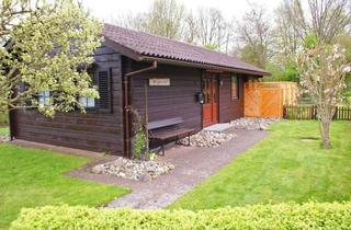 Haus kaufen in 24351 Damp, Blockhaus in TOP-Lage mit großem Grundstück und Wintergarten