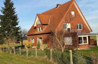 Wohnung kaufen in 33449 Langenberg, EG‑Wohnung mit eigener Garage und gemeinschaftlichen Außenflächen inkl. Ackerland