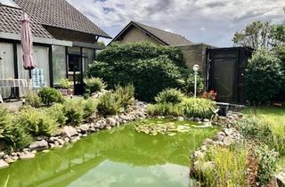 Einfamilienhaus kaufen in 32312 Lübbecke, Freistehendes Einfamilienhaus mit Wintergarten, Kamin und großem Garten in ruhiger Lage