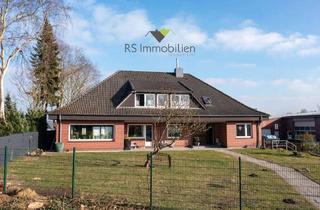 Haus kaufen in 26556 Westerholt, Walmdachbungalow mit zwei Wohneinheiten in zentraler Lage!