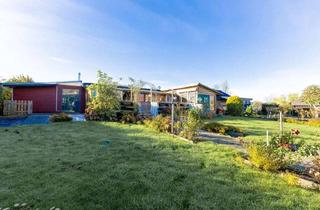 Haus kaufen in 25704 Nordermeldorf, Naturnah wohnen: Bungalow mit Kamin, 2 Bäder & Wintergarten