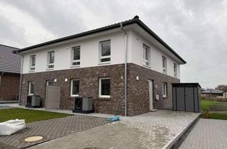 Haus kaufen in 21717 Fredenbeck, Modernes Doppelhaus mit zwei energieeffizienten Einheiten & Wärmepumpe
