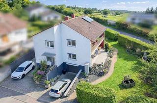 Haus kaufen in 63694 Limeshain, Zwei Wohnungen – viele Möglichkeiten: Familienhaus mit Terrasse, Balkon & Kamin