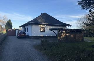 Haus kaufen in 27313 Dörverden, Dörverden-Hülsen: Charmanter Walmdachbungalow mit Keller, Garage und Carport auf großem Grundstück