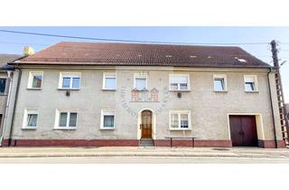 Haus kaufen in 06905 Pretzsch, Vollvermietet mit Garten, Garagen und Stellplätzen