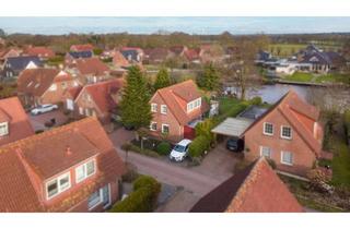 Haus kaufen in 26629 Großefehn, Ferienhaus am Timmeler Meer – Zwei Wohneinheiten mit privater Steganlage