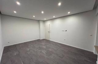 Wohnung kaufen in 50389 Wesseling, Wesseling - Frisch sanierte Eigentumswohnung mit Einzelgarage und Balkon