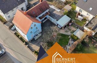Mehrfamilienhaus kaufen in 96163 Gundelsheim, Großzügiges Mehrfamilienhaus mit Doppelgarage, Gartenidylle und vielseitigem Nutzungspotenzial