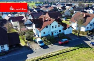 Haus kaufen in 63607 Wächtersbach, Wohnen mit Weitblick – Zweifamilienhaus mit Garten & Einliegerwohnung in Feldrandlage