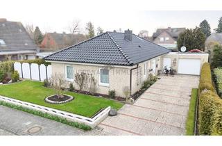 Haus kaufen in 26759 Hinte, Hinte: Modernisierter 5-Zimmer-Bungalow mit Garage, überdachter Terrasse, Garten und Ausbaureserve