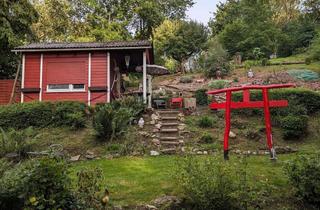 Grundstück zu kaufen in 37269 Eschwege, Freizeitgrundstück mit winterfestem Holzhaus und Gerätehaus in Eschwege