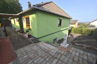 Einfamilienhaus kaufen in 55424 Münster-Sarmsheim, Münster-Sarmsheim - Eingefriedetes Einfamilienhaus mit ELW und zwei Garagen in bester Wohnlage