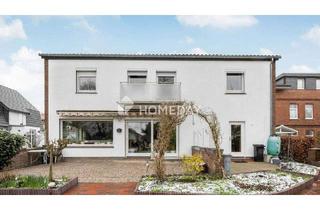 Haus kaufen in 26919 Brake, Brake (Unterweser) - Wohnen auf zwei Ebenen - Ihr neues Zuhause mit Kamin, Garten & Einliegerwohnung