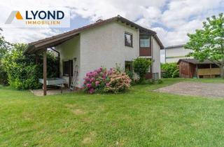 Haus kaufen in 34582 Borken, Borken - Wohnoase für die ganze Familie: Frei stehendes Haus mit großem Garten und Wintergarten!