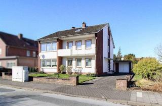 Haus kaufen in 33378 Rheda-Wiedenbrück, Rheda-Wiedenbrück - Zweifamilienhaus mit zwei Garagen und großem Garten in guter Lage von Rheda