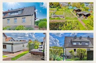 Doppelhaushälfte kaufen in 34270 Schauenburg, Schauenburg / Elgershausen - Individuelles Zweifamilienhaus mit großem Grundstück und Garage in bester Lage von Schauenburg-Elg.