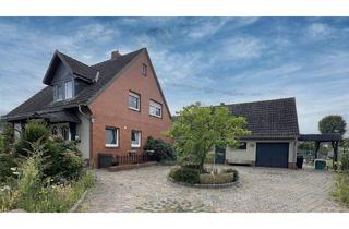 Einfamilienhaus kaufen in 49406 Barnstorf, Barnstorf - Vermietetes Einfamilienhaus mit großem Garten, Kaminofen und Garage in gepflegtem Zustand