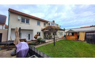 Einfamilienhaus kaufen in 64546 Mörfelden, Mörfelden - Vermietetes Haus mit Terrasse und eigenem Garten
