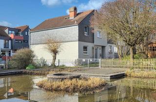 Haus kaufen in 61267 Neu-Anspach, Modernisiertes Massivhaus mit offenem Wohnbereich, Garten und Garage