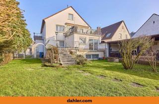 Haus kaufen in 64331 Weiterstadt, Wohnen mit Freiraum – charmantes Zweifamilienhaus