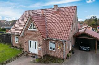 Einfamilienhaus kaufen in 26529 Upgant-Schott, Attraktives Einfamilienhaus mit moderner Ausstattung und überdachter Terrasse