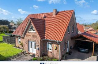 Einfamilienhaus kaufen in 26529 Upgant-Schott, Attraktives Einfamilienhaus mit moderner Ausstattung und überdachter Terrasse