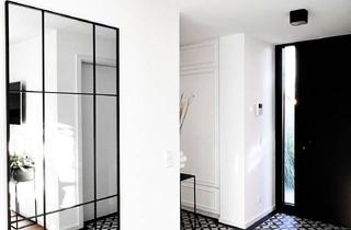 Einfamilienhaus kaufen in 64546 Mörfelden-Walldorf, Moderner L-förmiger Bungalow mit stilvollem Wohnkonzept und traumhaftem Garten.