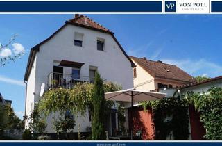 Einfamilienhaus kaufen in 64521 Groß-Gerau, Groß Gerau - Lichtdurchflutetes Familiendomizil mit stilvollem Garten und Wohlfühlambiente