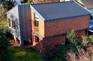 Haus kaufen in 34225 Baunatal, Zeitloses Architektenhaus mit Split-Level-Charakter in begehrter Lage von Baunatal-Großenritte