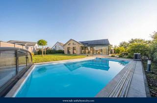 Haus kaufen in 29339 Wathlingen, Premium-Neubau-Bungalow mit Pool und barrierearmem Wohnkonzept in Feldrandlage bei Celle