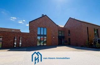 Wohnung kaufen in 26802 Moormerland, Neubau Erdgeschosswohnung mit Terrasse und Garten