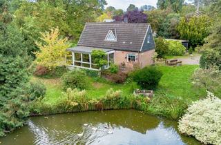 Einfamilienhaus kaufen in 24222 Schwentinental, Idyllisches Einfamilienhaus auf traumhaftem Naturgrundstück mit Teich – nur wenige Minuten von Kiel