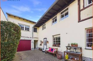 Haus kaufen in 41836 Hückelhoven, Gepflegtes Zweifamilienhaus mit Innenhof, Garage und großem Garten in Hückelhoven-Brachelen