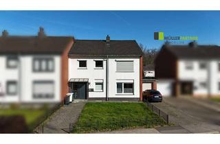 Haus kaufen in 52249 Eschweiler, Einseitig angebautes Zweifamilienhaus mit Garage in guter Lage von Eschweiler