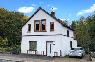 Einfamilienhaus kaufen in 28757 Bremen, Wohnen mit viel Platz auf einem großen Grundstück mit Hanglage, Dachterrasse und großzügigem Garten