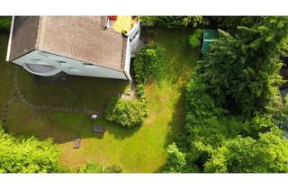 Wohnung kaufen in 82031 Grünwald, Gartenwohnung mit viel Licht & Raumgefühl – Wohnen auf zwei Ebenen oder mit Einliegerwohnung