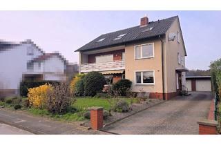 Haus kaufen in 33790 Halle, Wohnhaus mit drei Wohneinheiten, Doppelgarage und Bauplatzreserve