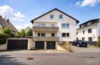 Mehrfamilienhaus kaufen in 71272 Renningen, Renningen - Attraktives, gepflegtes Mehrfamilienhaus mit Balkonen und Garagen!