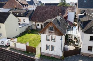Einfamilienhaus kaufen in 35510 Butzbach, Charmantes Einfamilienhaus mit Scheune und großem Hof in zentraler Lage von Butzbach