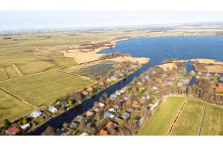 Haus kaufen in 26725 Uphusen/Marienwehr, Gemütliches Rückzugsdomizil am kleinen Meer mit eigenem Bootssteg