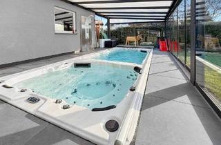 Einfamilienhaus kaufen in 53894 Mechernich, Mechernich - Leben mit Spa-Feeling - Wohnen mit Pool, Wintergarten und Premium-Ausstattung