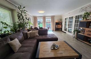 Wohnung kaufen in 25761 Büsum, Moderne 3-Zimmer-Erdgeschosswohnung mit Wintergarten, zwei Terrassen und Garten in Büsum