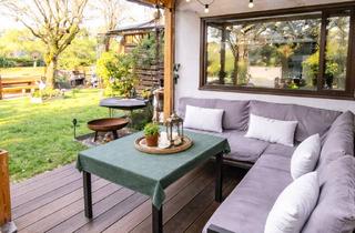 Wohnung kaufen in 69226 Nußloch, Charmante Erdgeschosswohnung mit großem Garten & überdachter Terrasse in ruhiger Lage von Nußloch