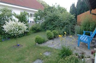 Wohnung kaufen in 85405 Nandlstadt, Charmante Dreizimmerwohnung mit Kachelofen und Garten